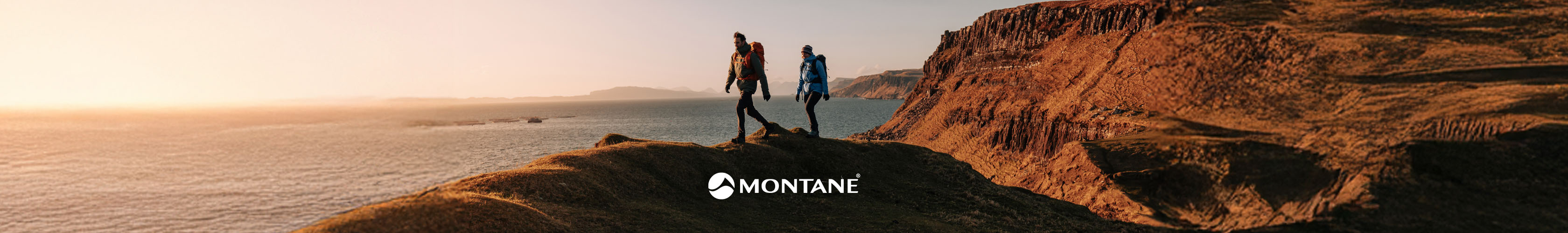 Montane. two people walking across mountain
